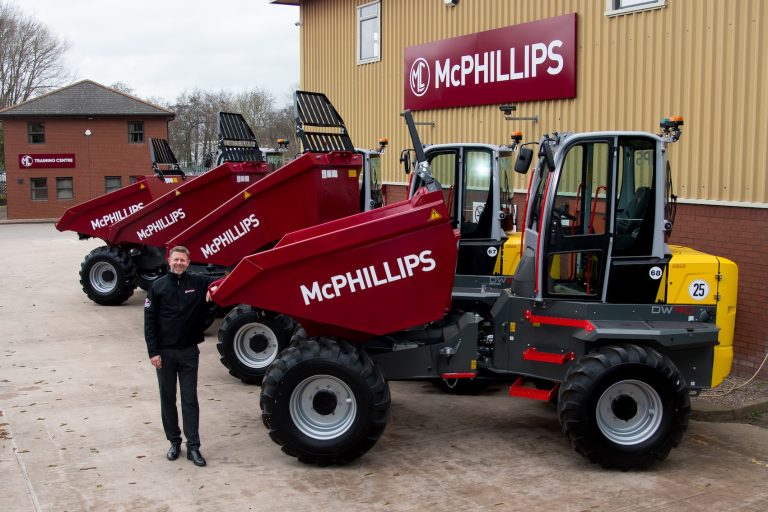 Ian Roberts pictured with the fleet of new Wacker Neuson dumpers at McPhillips HQ.
