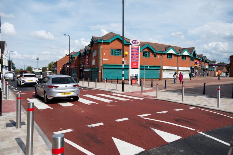 A zebra crossing in the middle of a high street.